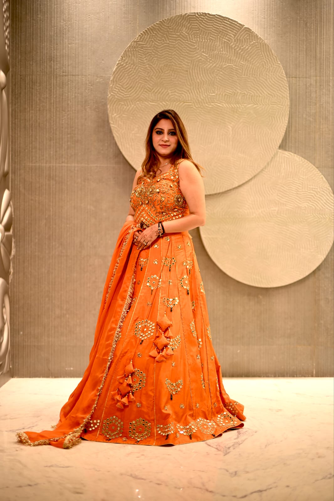 Vibrant Orange Kundan Embroidered Lehenga